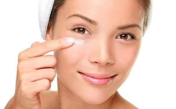 apply a cream to rejuvenate the skin around the eyes